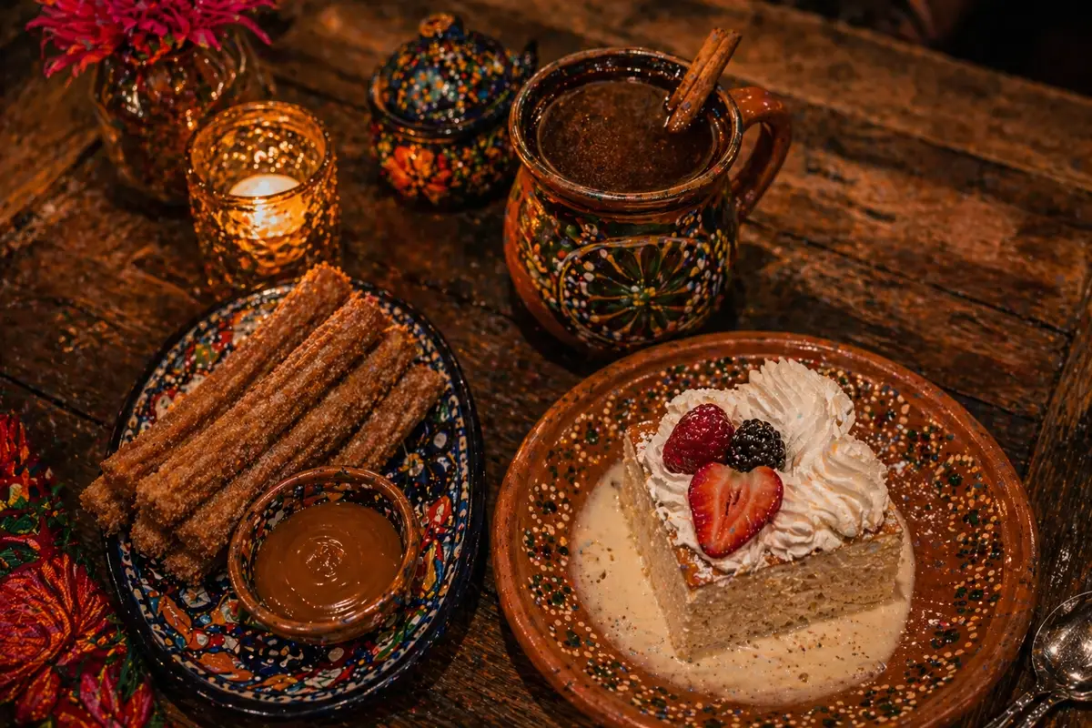 Traditional Mexican desserts at La Milpa restaurant: churros with cajeta, pastel de tres leches and café de olla